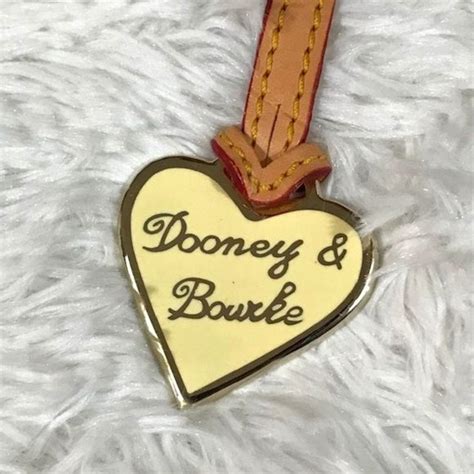 fake dooney and bourke heart charm|dooney and bourke handbags false.